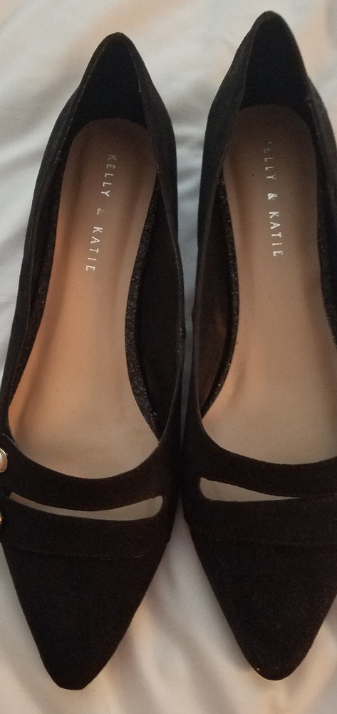 Black flats with pearl buttons
